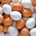 Brown and white eggs in a pile