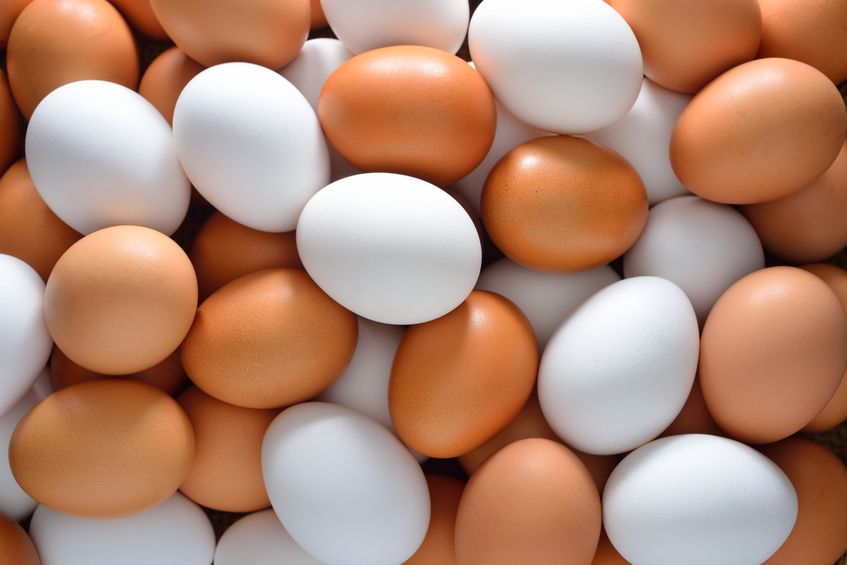 Brown and white eggs in a pile
